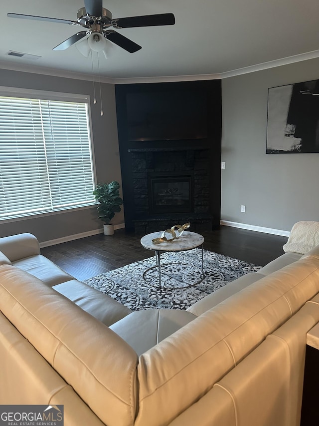 living room featuring ceiling fan, dark hardwood / wood-style floors, and ornamental molding