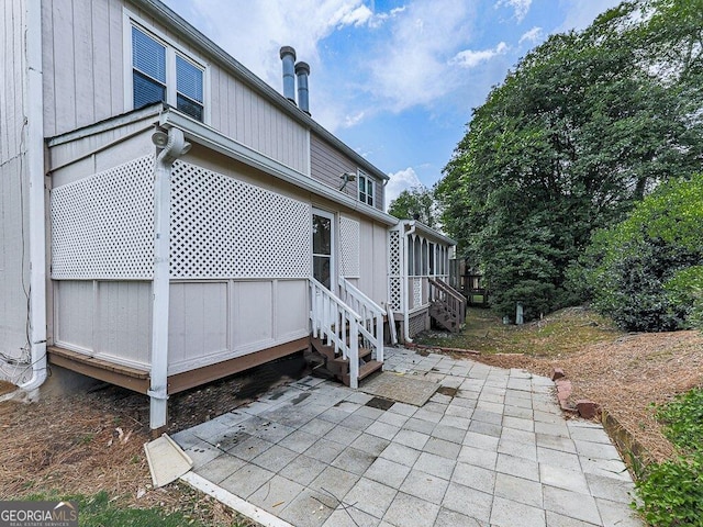 back of property with a patio