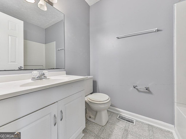 full bathroom with vanity with extensive cabinet space, a textured ceiling, tile floors, toilet, and bathing tub / shower combination