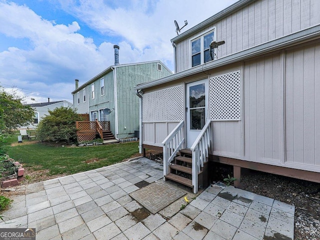 exterior space featuring a yard and a patio