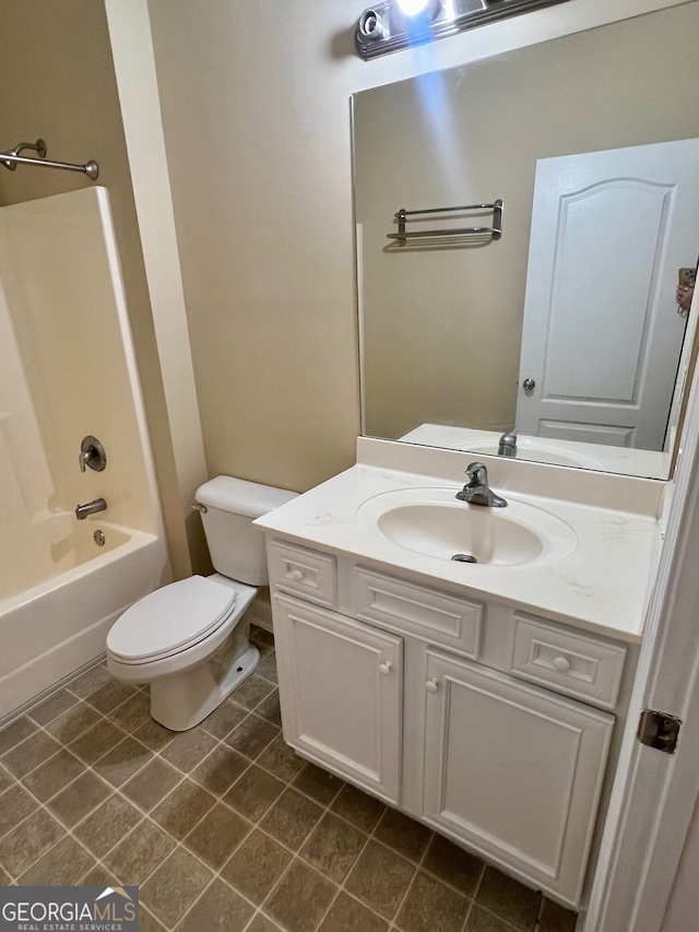 full bathroom with bathtub / shower combination, large vanity, tile floors, and toilet