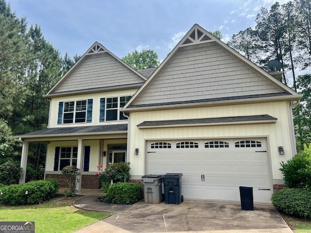 craftsman inspired home with covered porch and a garage