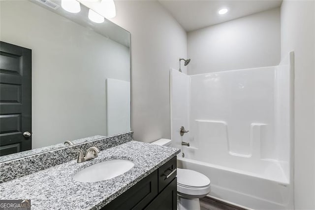 full bathroom with wood-type flooring, vanity, toilet, and shower / bathtub combination