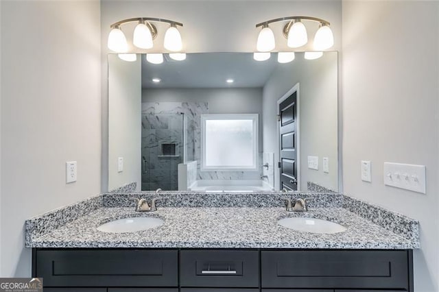 bathroom featuring vanity with extensive cabinet space, double sink, and plus walk in shower