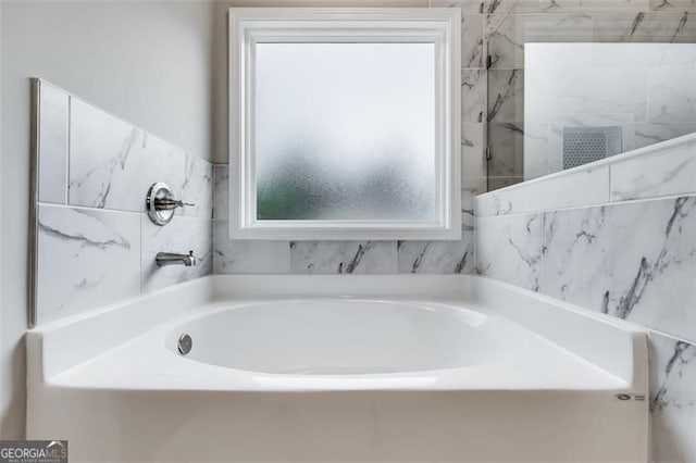 bathroom with a bathing tub