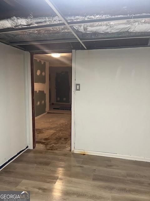 1433 Woodland Ter SW, Atlanta, GA 30311 - hallway with wood finished floors and baseboards