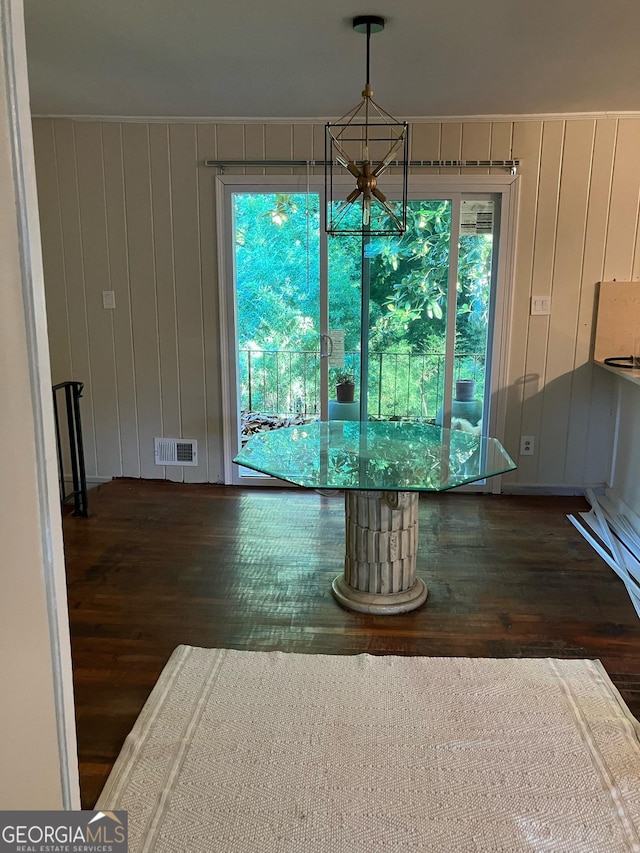 1433 Woodland Ter SW, Atlanta, GA 30311 - unfurnished dining area with wood finished floors, a chandelier, plenty of natural light, and wood walls