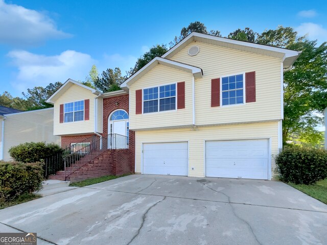 raised ranch featuring a garage