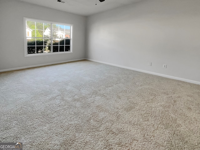 unfurnished room featuring carpet floors