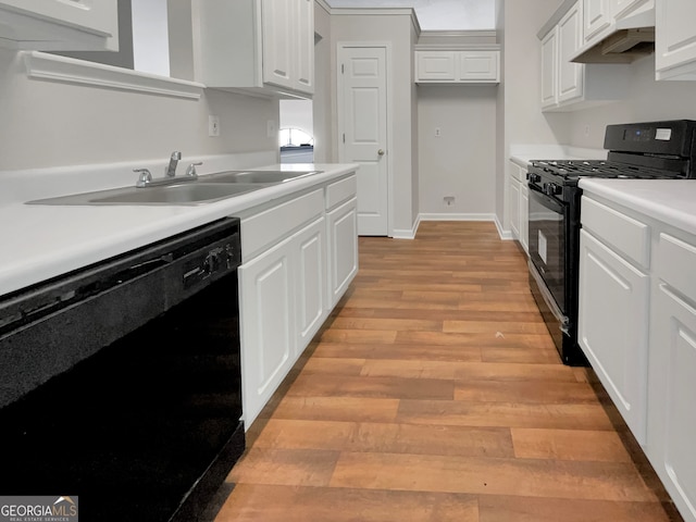 kitchen featuring light hardwood / wood-style flooring, sink, white cabinetry, and black appliances