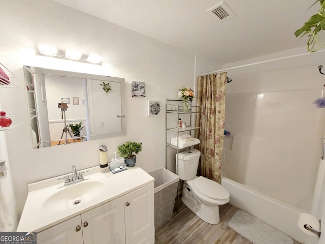 full bathroom featuring vanity, shower / bath combo, toilet, and hardwood / wood-style flooring