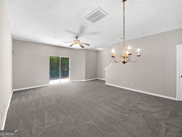 unfurnished room with ceiling fan with notable chandelier, a textured ceiling, and dark colored carpet