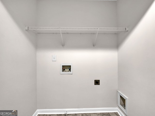 washroom featuring wood-type flooring, hookup for a washing machine, and electric dryer hookup