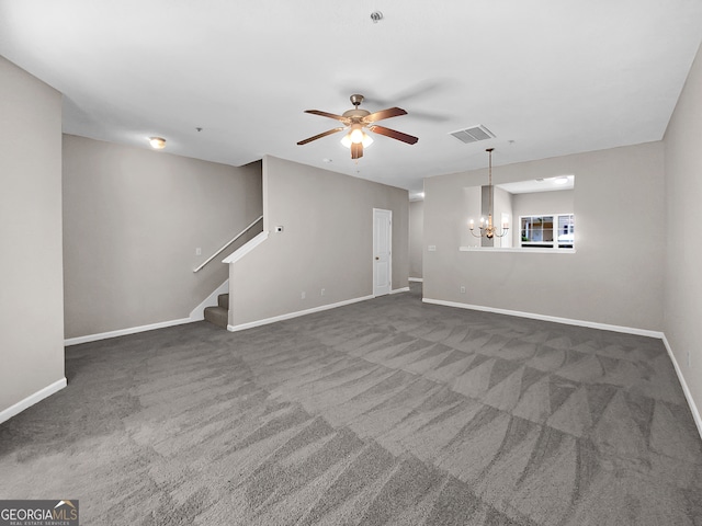 interior space with ceiling fan with notable chandelier and carpet