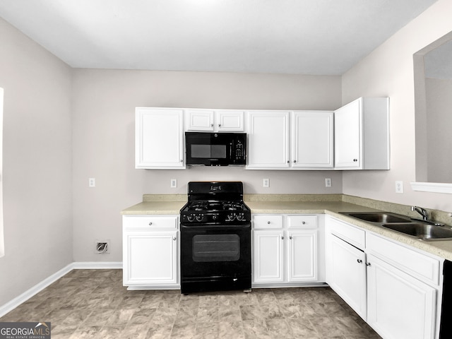 kitchen with light tile floors, white cabinetry, black appliances, and sink