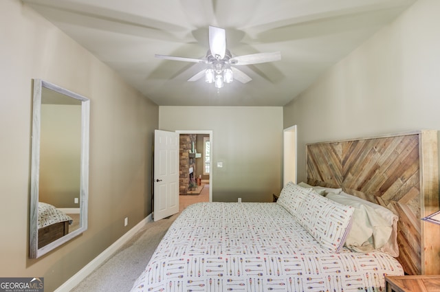 bedroom featuring light colored carpet and ceiling fan