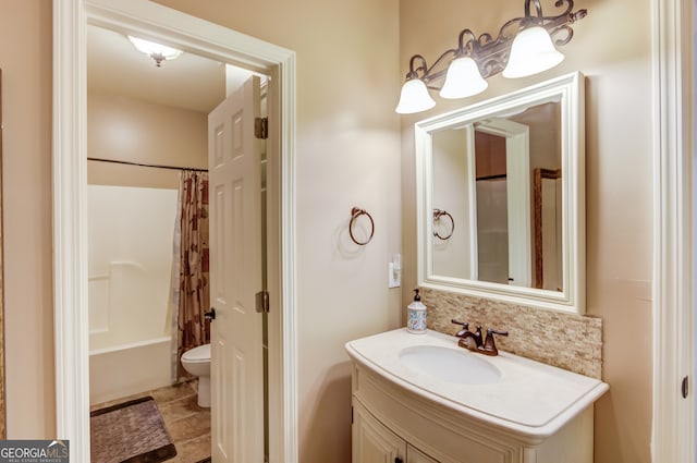 full bathroom featuring vanity, tile floors, toilet, and shower / tub combo