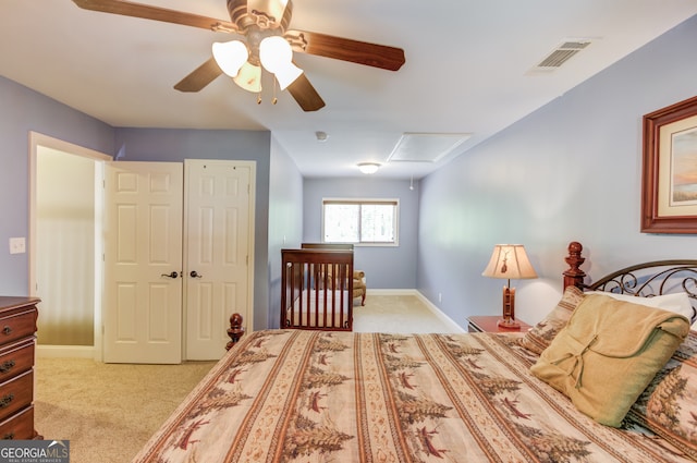 carpeted bedroom with a closet and ceiling fan