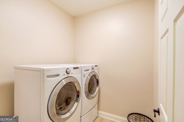 washroom featuring washing machine and dryer