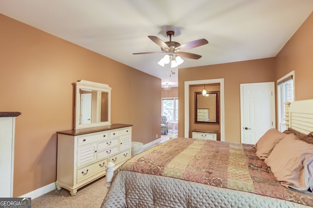 bedroom with ceiling fan and carpet