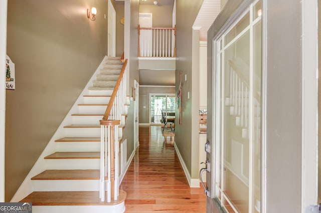 staircase with light hardwood / wood-style flooring