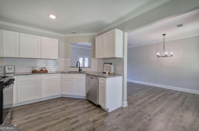 kitchen with white cabinetry, stainless steel appliances, backsplash, wood-type flooring, and sink