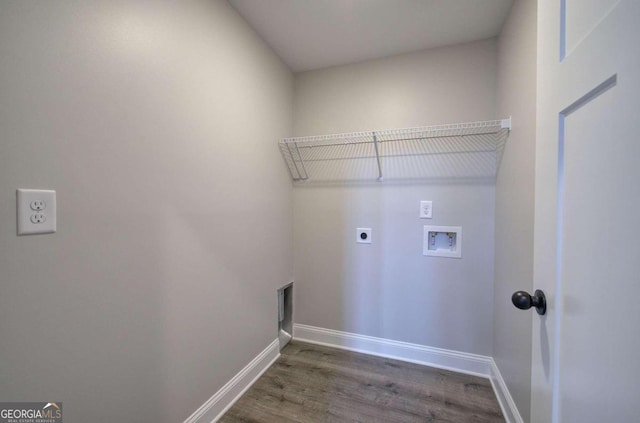 laundry room with dark hardwood / wood-style floors, hookup for a washing machine, and hookup for an electric dryer