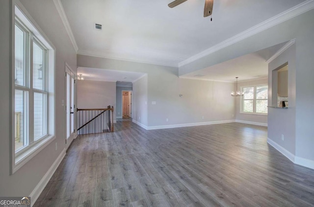 unfurnished room with ceiling fan with notable chandelier, ornamental molding, and dark hardwood / wood-style flooring