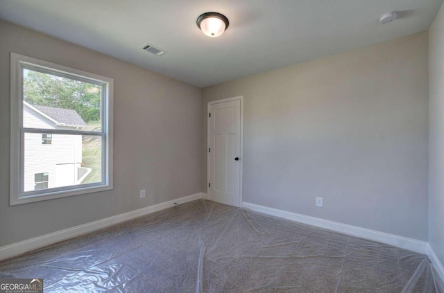 view of carpeted spare room