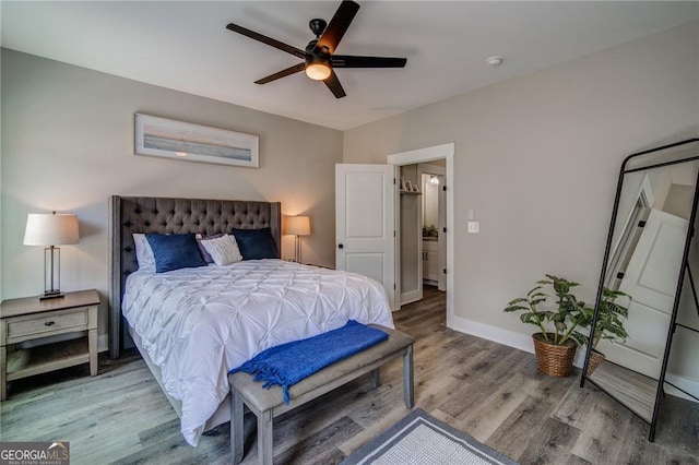 bedroom featuring hardwood / wood-style flooring and ceiling fan