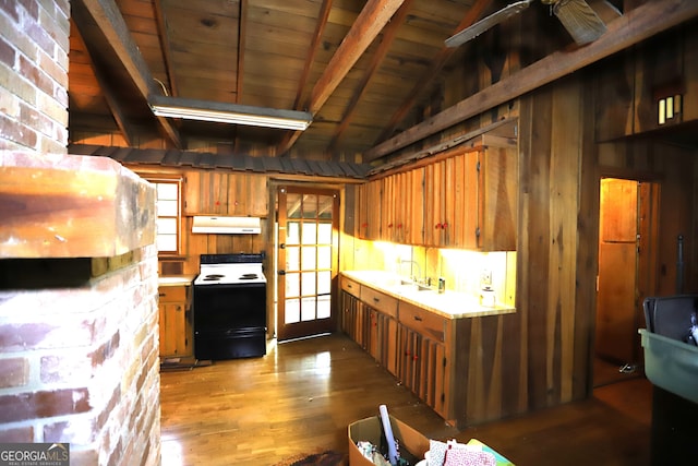 kitchen featuring hardwood / wood-style floors, vaulted ceiling with beams, range hood, white range with electric stovetop, and brick wall