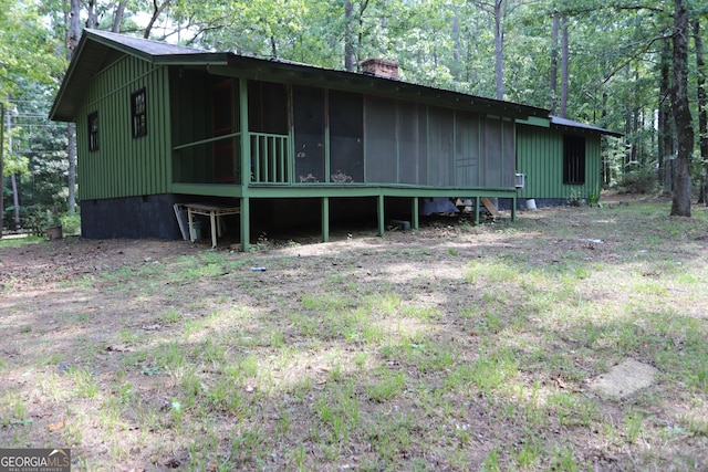 350 County Road 700, Cedar Bluff, AL 35959 - view of side of property with a chimney, a sunroom, and a wooded view
