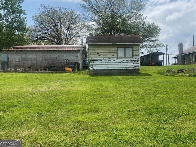 rear view of house with a lawn