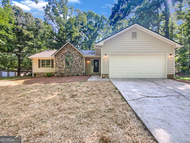 ranch-style house featuring a garage