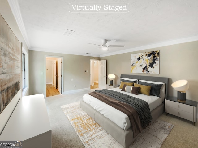 carpeted bedroom featuring ceiling fan and crown molding