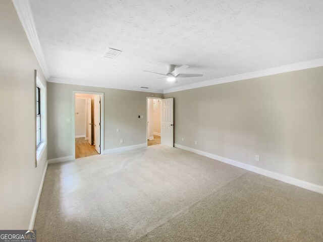 unfurnished room featuring ornamental molding, light hardwood / wood-style flooring, and ceiling fan