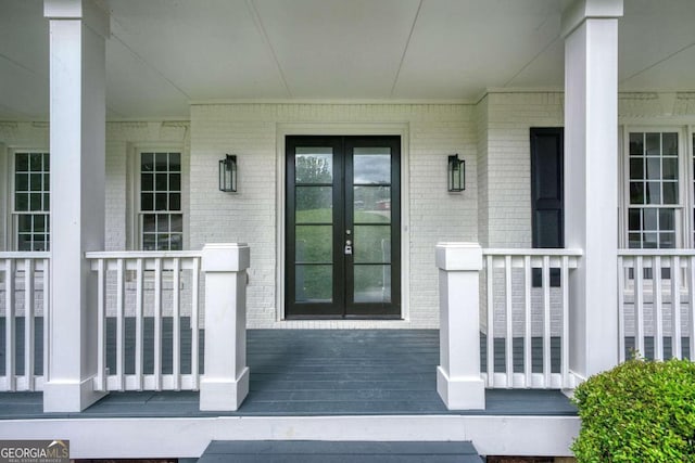 property entrance with french doors and a porch