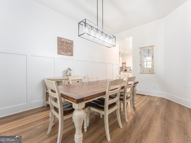 dining area featuring wood-type flooring