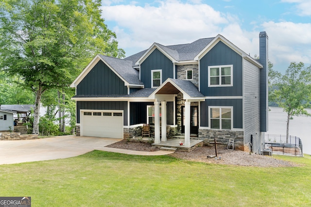 craftsman inspired home with a garage and a front yard