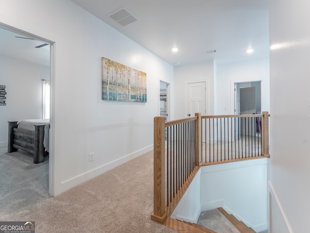 hallway with carpet flooring