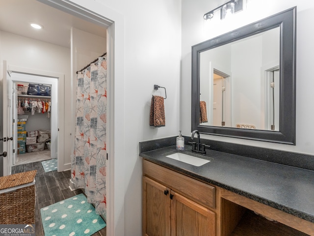 bathroom with wood-type flooring and vanity