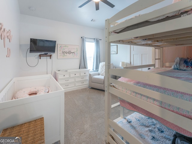 carpeted bedroom featuring ceiling fan