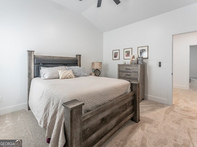 carpeted bedroom featuring lofted ceiling and ceiling fan