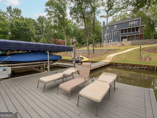 view of dock featuring a yard