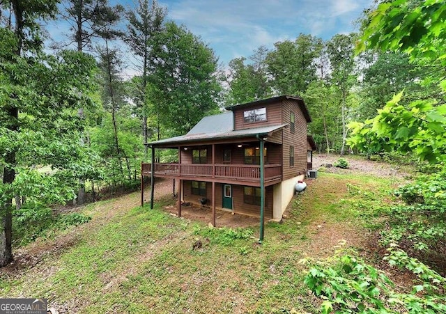 back of property with a wooden deck