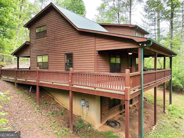 back of property with a wooden deck