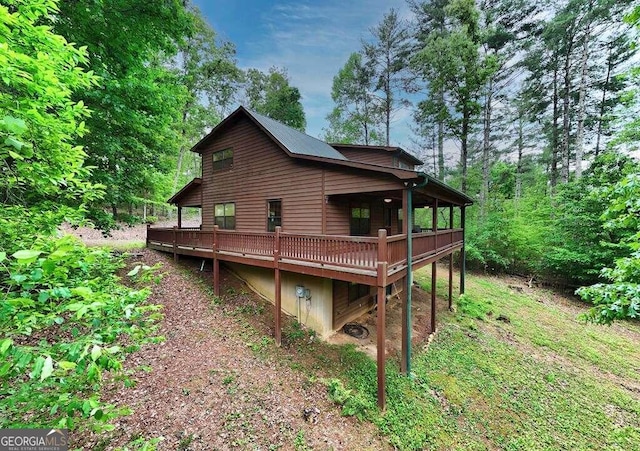 back of property featuring a deck