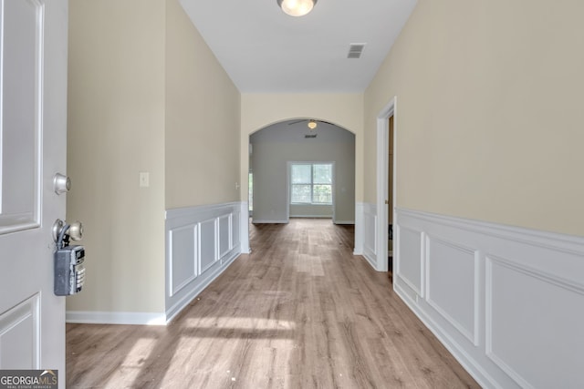 hall with light hardwood / wood-style flooring