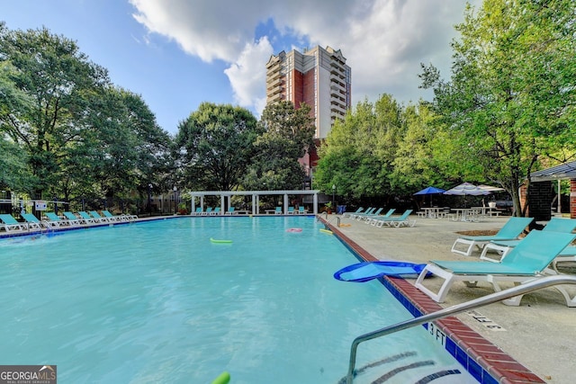 view of pool featuring a patio