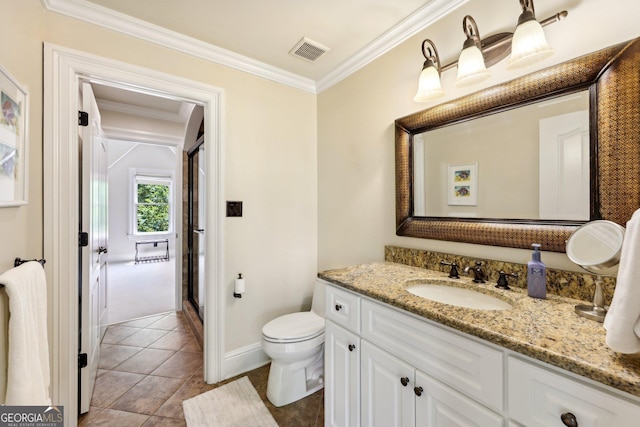 bathroom featuring tile patterned floors, toilet, vanity, a shower with shower door, and ornamental molding